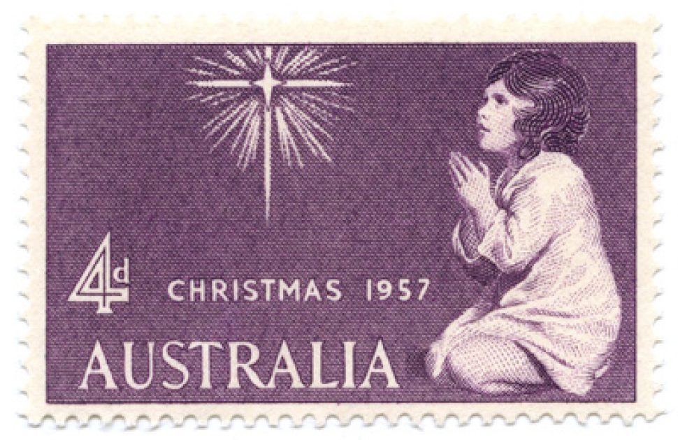 Purple 4d stamp from Christmas 1957, showing a young girl on her knees praying to a far off star
